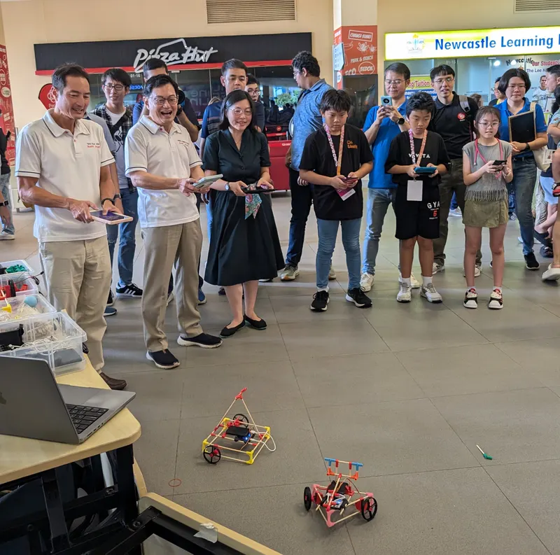 Ministers watch the robot cars race