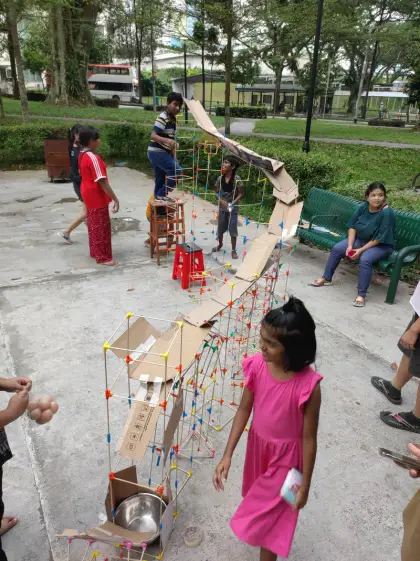 A cardboard marble run in the courtyard
