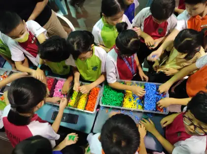 Many hands in the parts tray