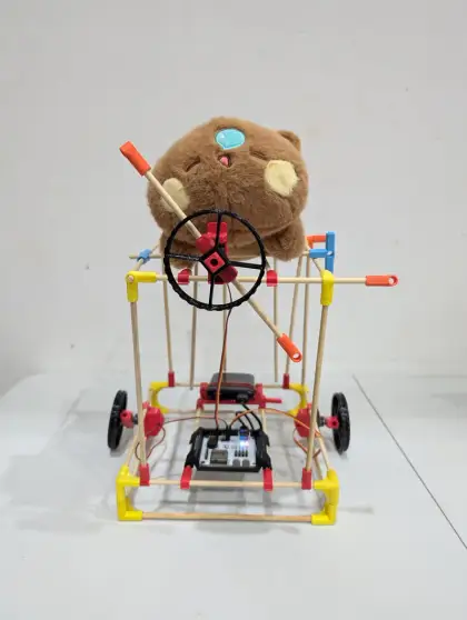 A cart carrying a teddy bear passenger
