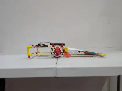 A cart on its side, wires exposed