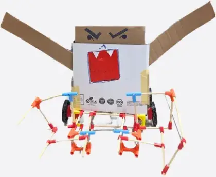 A spider bot with a cardboard face
