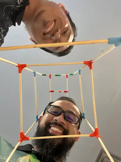 An upside-down selfie through a chopstick cube