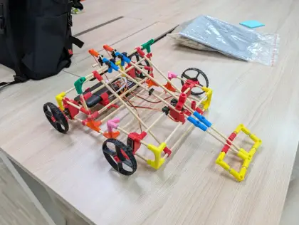 A chassis beside its parts bag