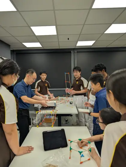 Students and teachers build towers at Dunman Secondary