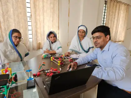 Teachers building robot cars in India