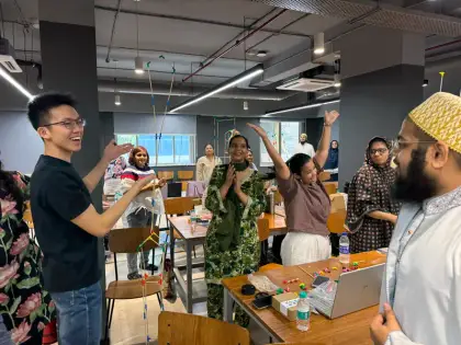 Teachers cheering their build