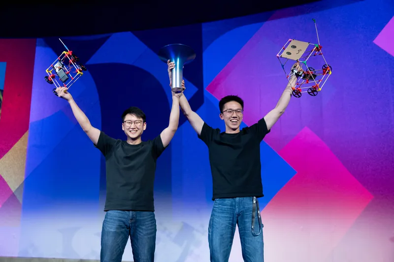 The founders with the Hult Prize trophy