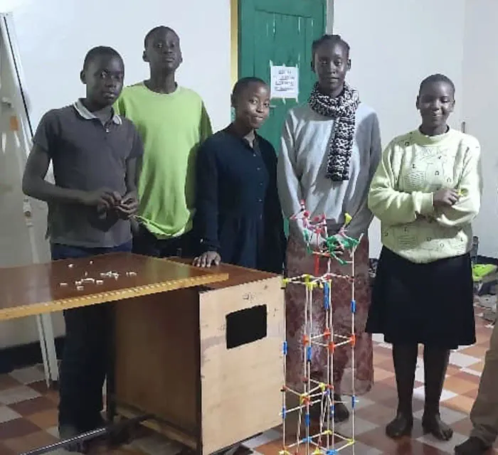 Students in Uganda with a build made from chopsticks and connectors